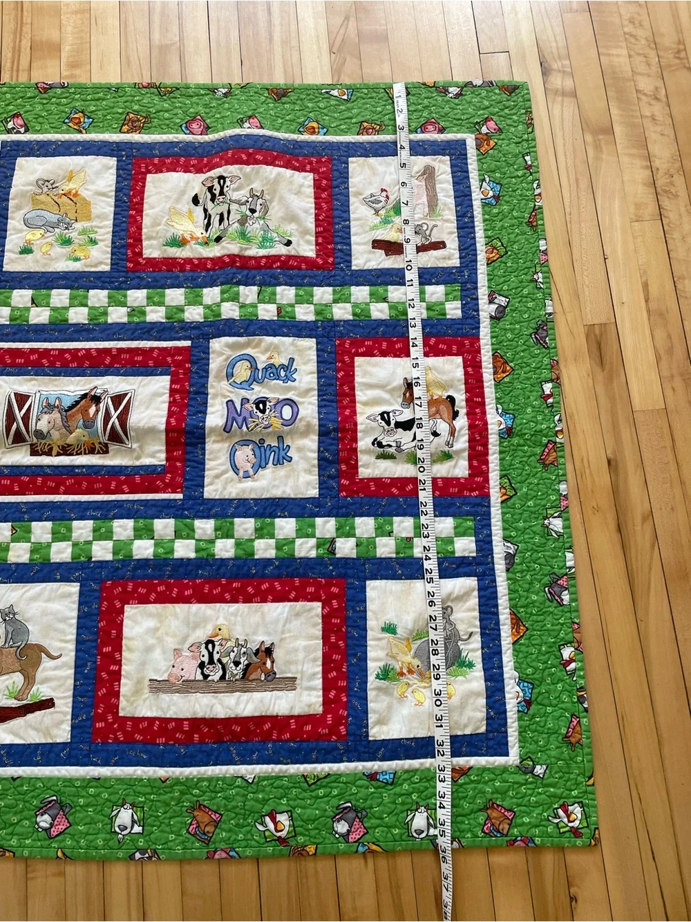 Quack, Moo, Oink quilt with farm animals and 'Quack, Moo, Oink'